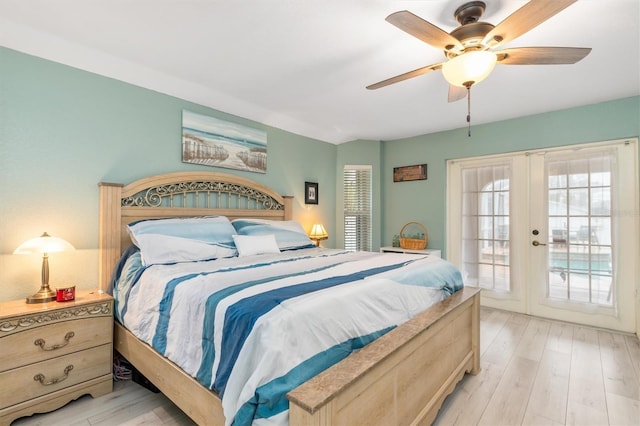 bedroom featuring french doors, light hardwood / wood-style floors, ceiling fan, and access to outside