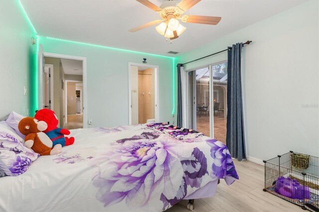 bedroom featuring light wood-type flooring, ceiling fan, and access to outside