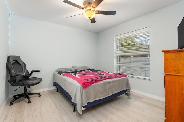 bedroom featuring ceiling fan and light hardwood / wood-style flooring