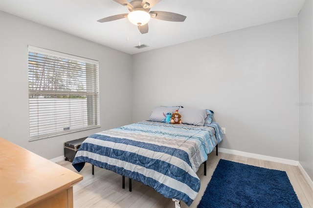 bedroom featuring ceiling fan and hardwood / wood-style flooring