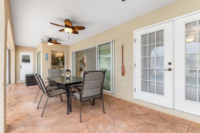 sunroom / solarium featuring ceiling fan and french doors