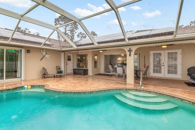 view of pool with a patio area, ceiling fan, and french doors