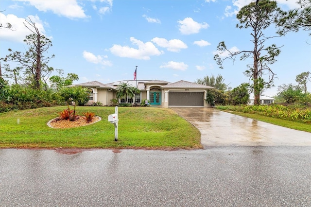 single story home featuring a garage and a front lawn