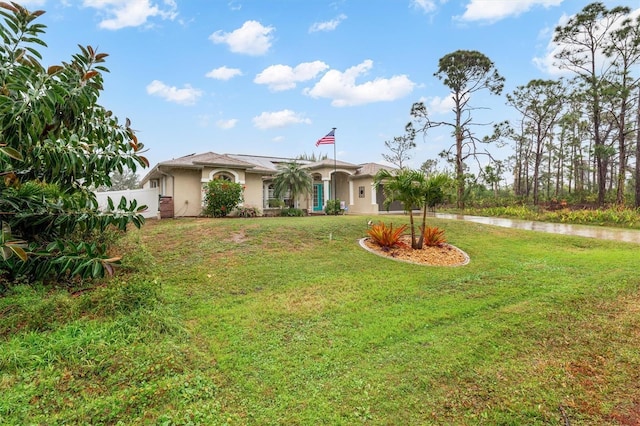 view of front facade with a front yard