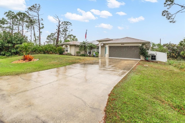 single story home with a garage and a front yard