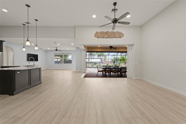 kitchen with ceiling fan and decorative light fixtures