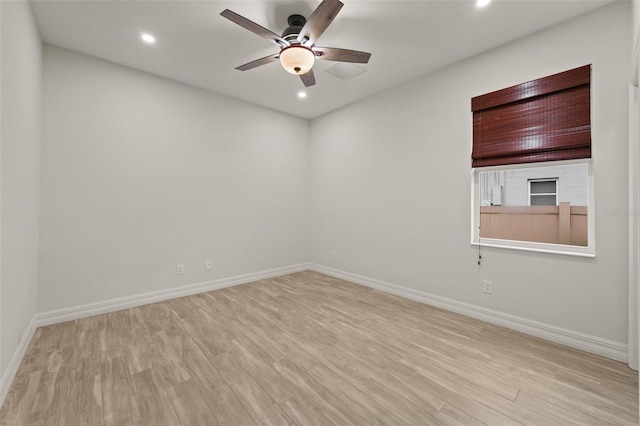 unfurnished room with ceiling fan and light hardwood / wood-style floors