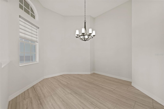 empty room with an inviting chandelier