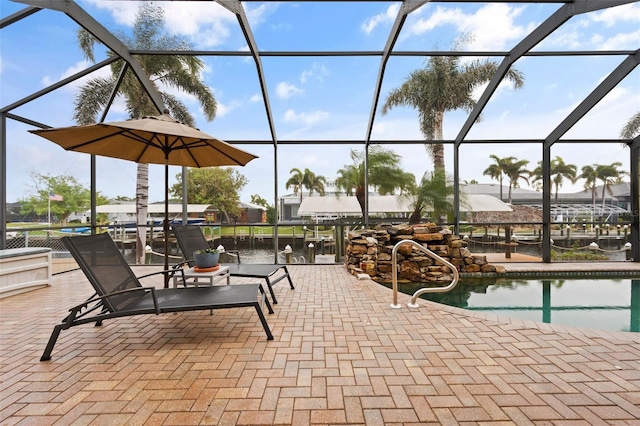 view of swimming pool featuring a water view, a lanai, and a patio area