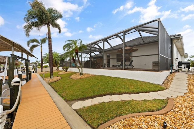 view of yard featuring glass enclosure