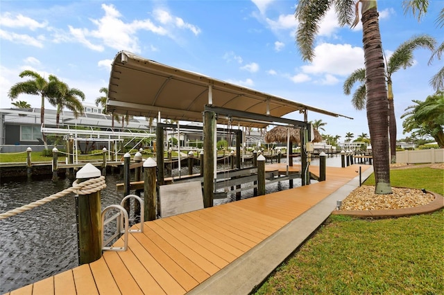 dock area with a yard and a water view