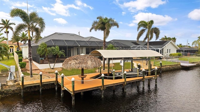 dock area featuring a water view and glass enclosure