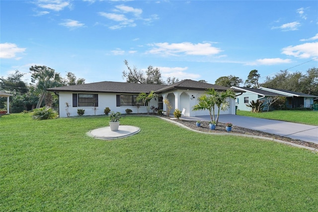 ranch-style house with a garage and a front yard