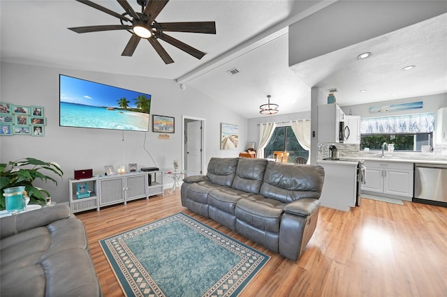 living room featuring sink, light hardwood / wood-style flooring, lofted ceiling with beams, and ceiling fan