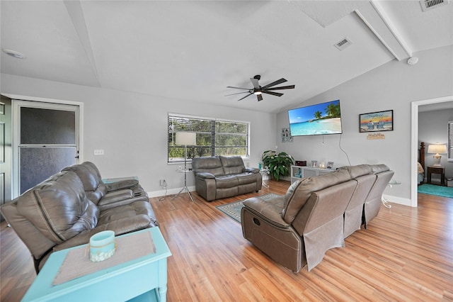 living room featuring ceiling fan, light hardwood / wood-style flooring, and vaulted ceiling with beams