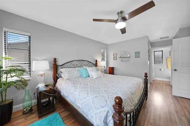 bedroom featuring dark wood-type flooring and ceiling fan