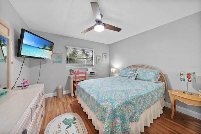 bedroom featuring ceiling fan and wood-type flooring