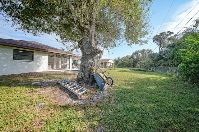 view of yard featuring a sunroom