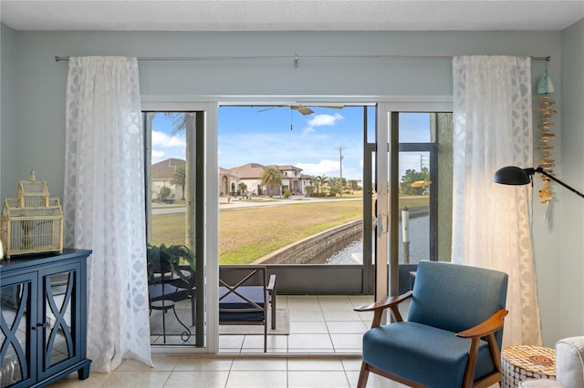 doorway to outside with light tile patterned floors