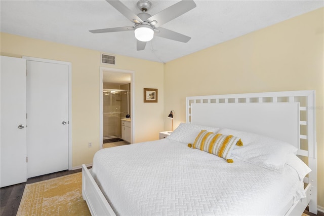 bedroom featuring ceiling fan, hardwood / wood-style floors, and ensuite bathroom