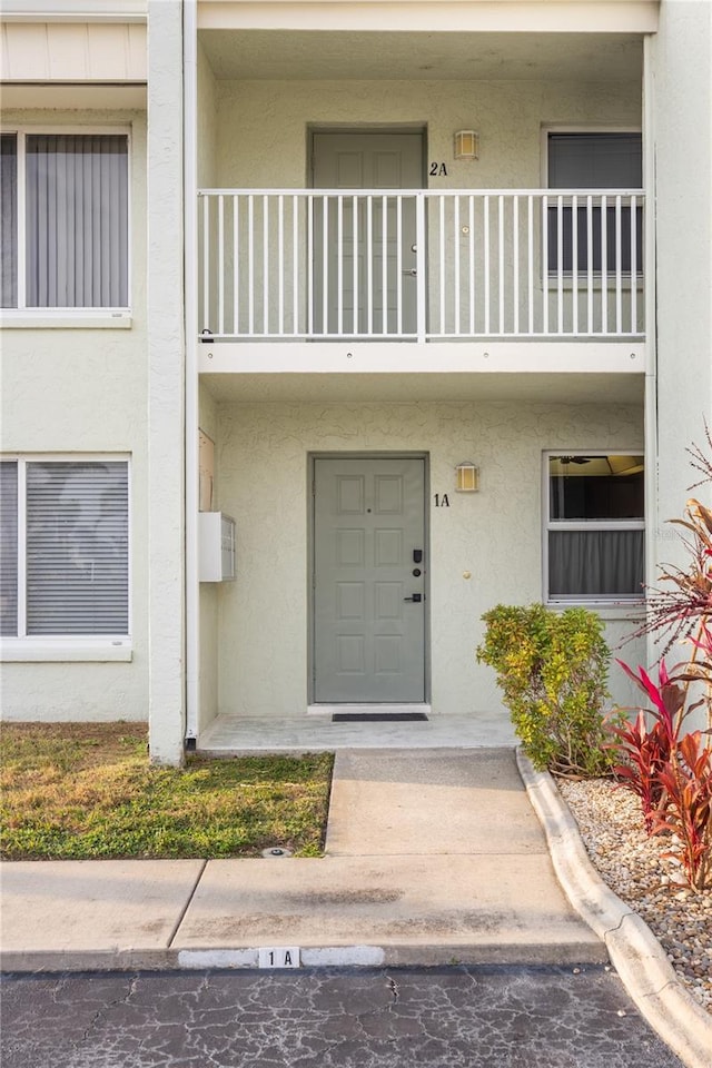 property entrance with a balcony