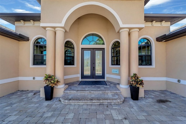 doorway to property featuring french doors