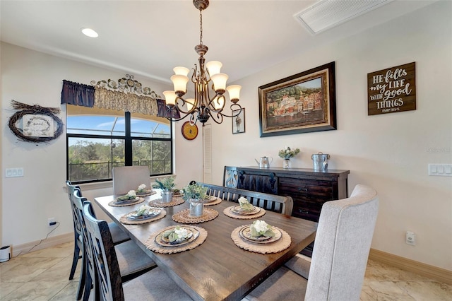 tiled dining space with a notable chandelier