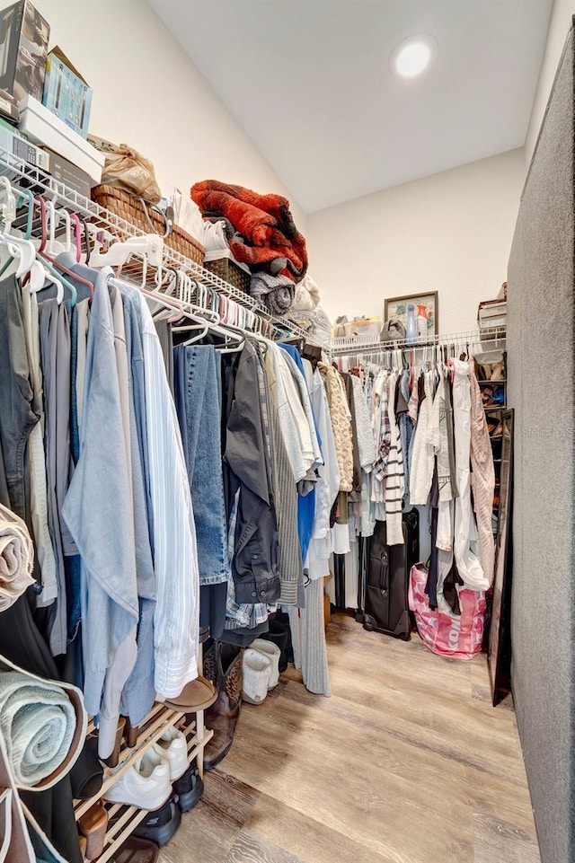 walk in closet featuring light hardwood / wood-style flooring