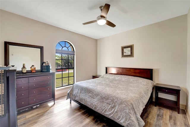 bedroom featuring wood-type flooring and ceiling fan