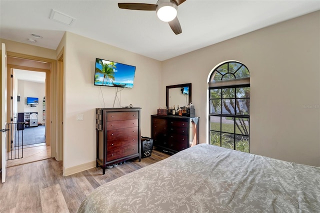 bedroom featuring ceiling fan and light hardwood / wood-style floors