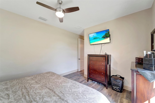 bedroom featuring ceiling fan and hardwood / wood-style floors