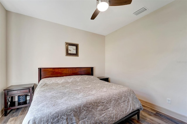 bedroom with hardwood / wood-style flooring and ceiling fan