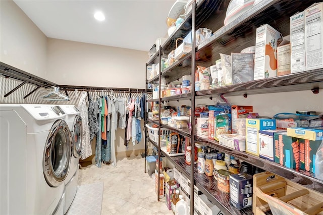 storage area featuring washer and dryer