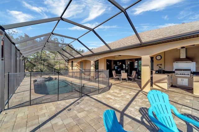 view of pool featuring a grill, exterior kitchen, a lanai, ceiling fan, and a patio area