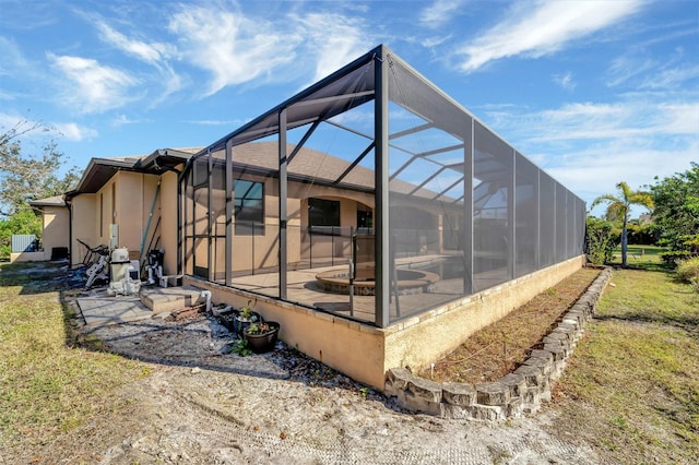 exterior space with a lanai and a patio