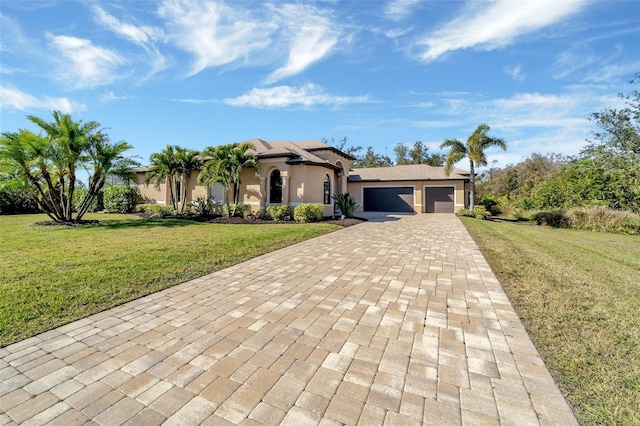 view of front facade with a garage and a front yard