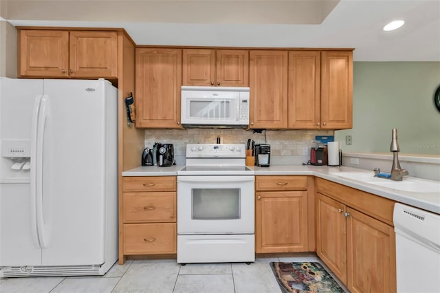 kitchen featuring sink, white appliances, backsplash, and light tile patterned flooring