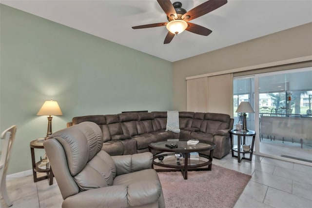 tiled living room featuring ceiling fan