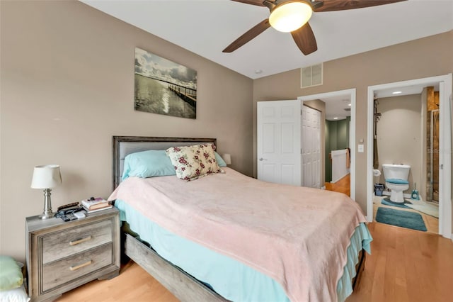 bedroom with connected bathroom, ceiling fan, and light wood-type flooring