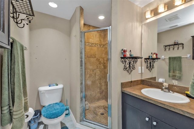 bathroom featuring vanity, toilet, and walk in shower