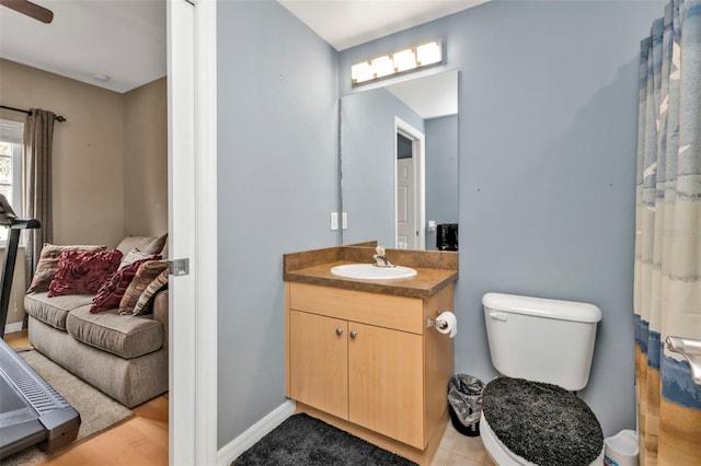 bathroom featuring tile patterned floors, vanity, and toilet