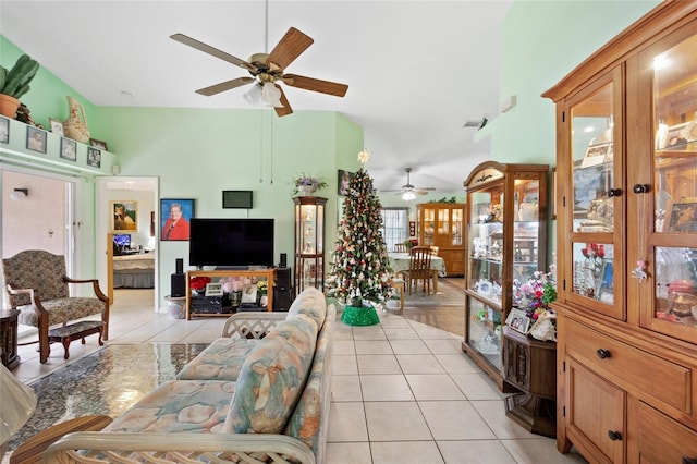 tiled living room featuring lofted ceiling and ceiling fan