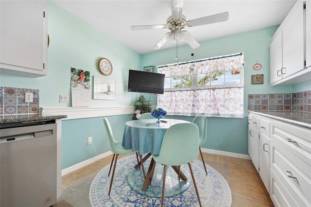 tiled dining area with ceiling fan