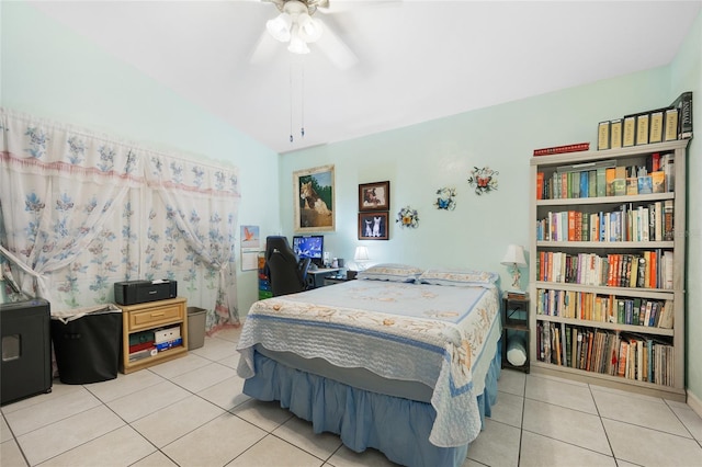 tiled bedroom featuring vaulted ceiling and ceiling fan