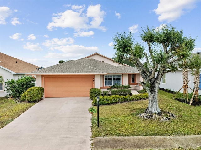 single story home with a garage and a front yard