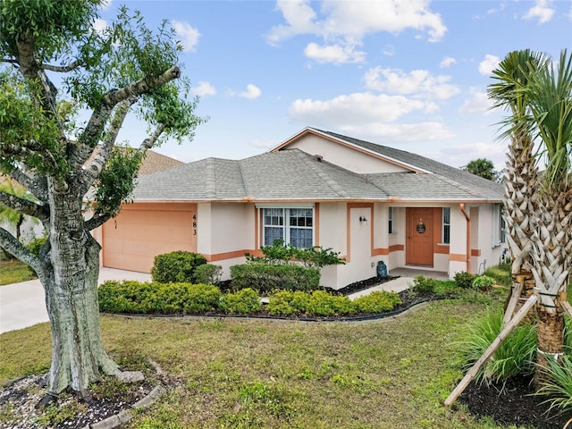 single story home with a garage and a front lawn