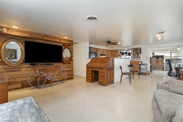 living room featuring ceiling fan