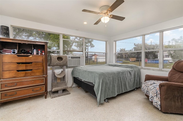 bedroom featuring cooling unit and ceiling fan