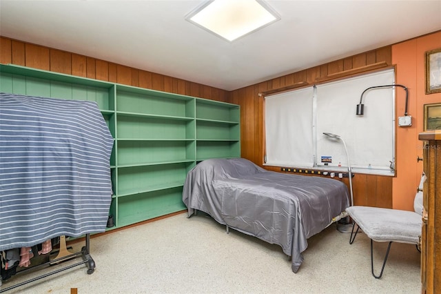 bedroom with wood walls