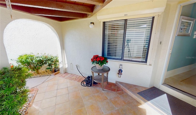 entrance to property featuring a patio area